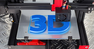 A high-tech 3D printer in the middle of printing a blue “3” and “D” logo made from plastic resin materials.